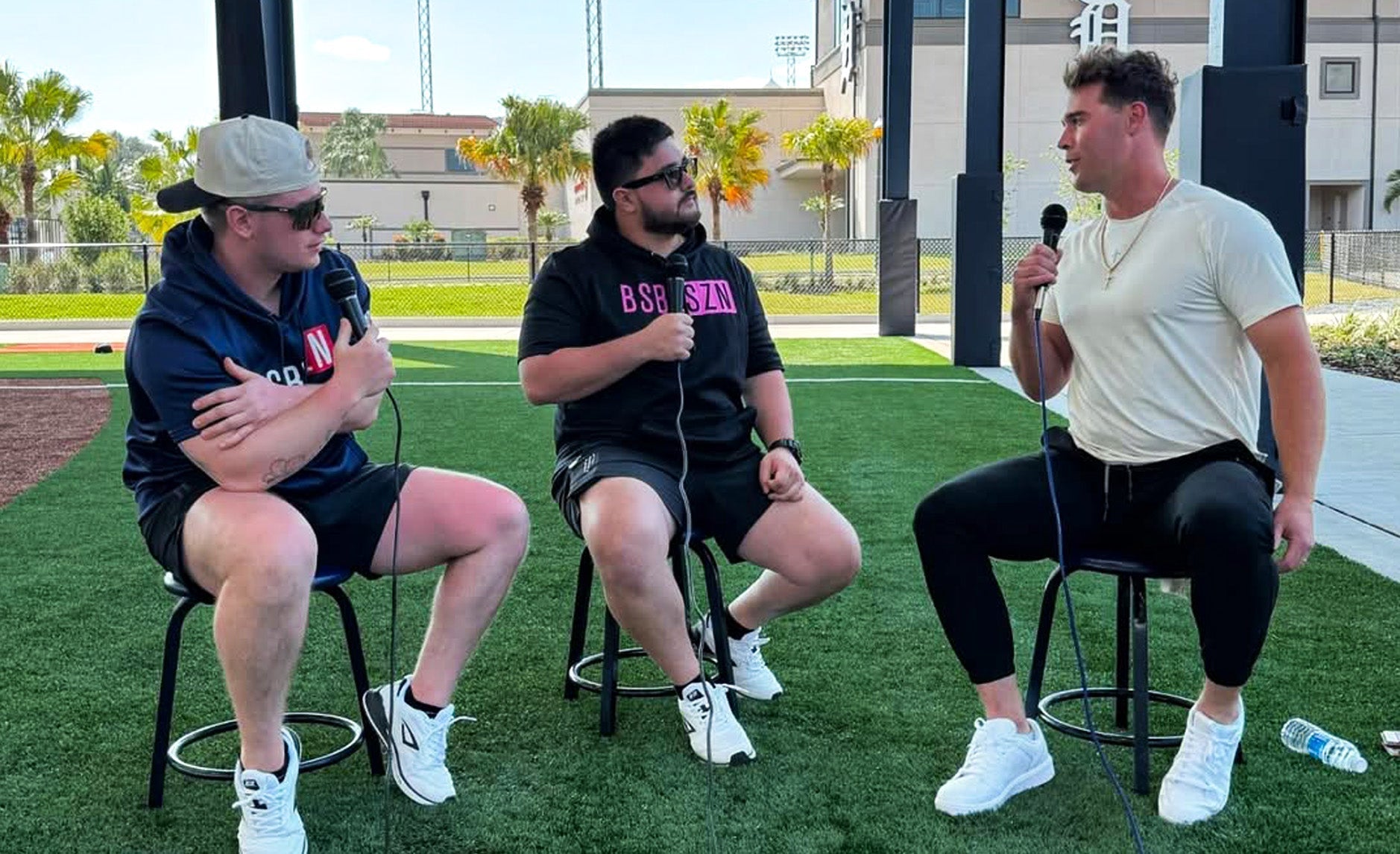 Nicky Cass and Perry Quartuccio wear 3N2 Pro Clutch Turf trainer shoes while interviewing Detroit Tigers' Kerry Carpenter at the MLB Spring Training in Sarasota, Florida